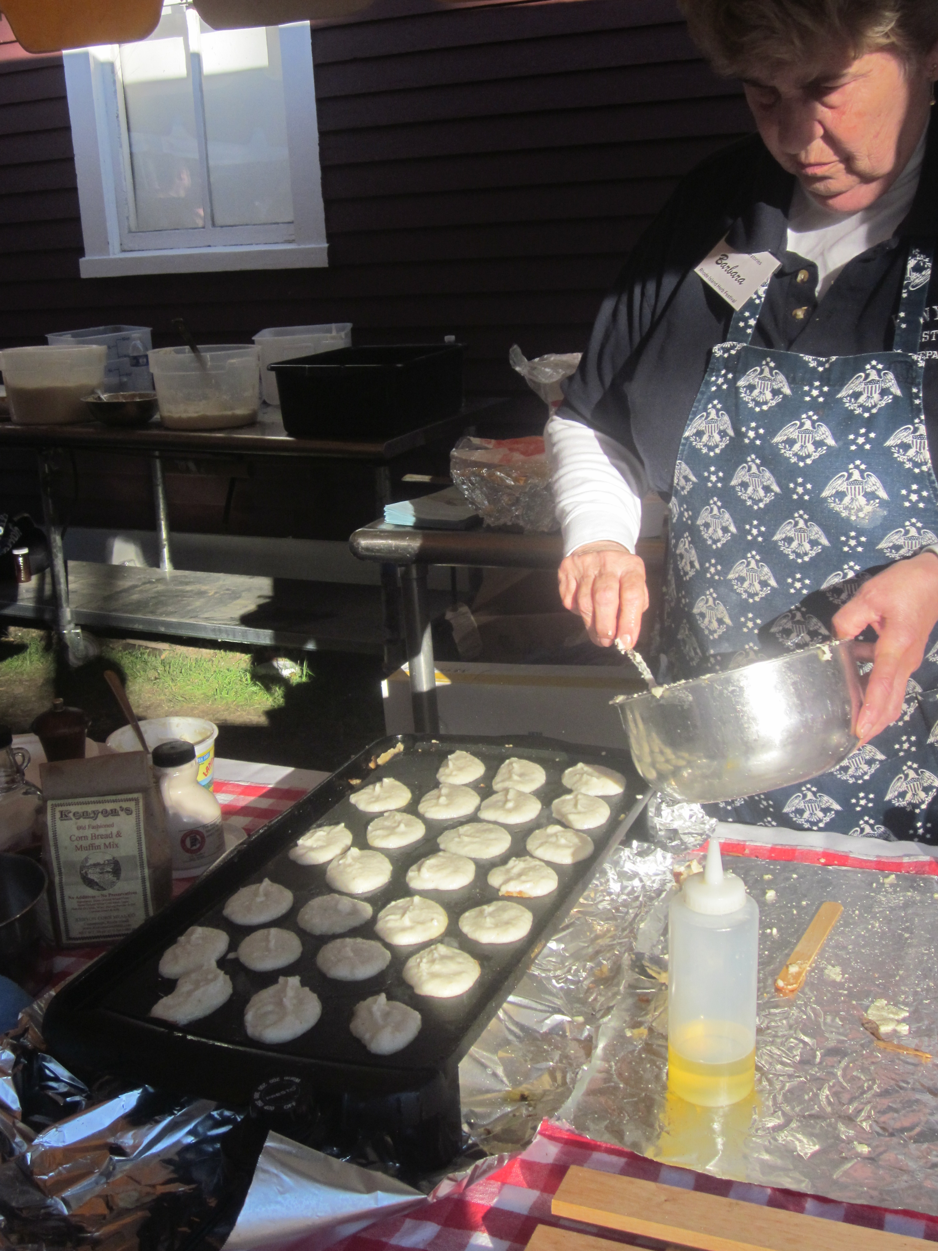 Barbara Stetson making Jonnycakes at the festival