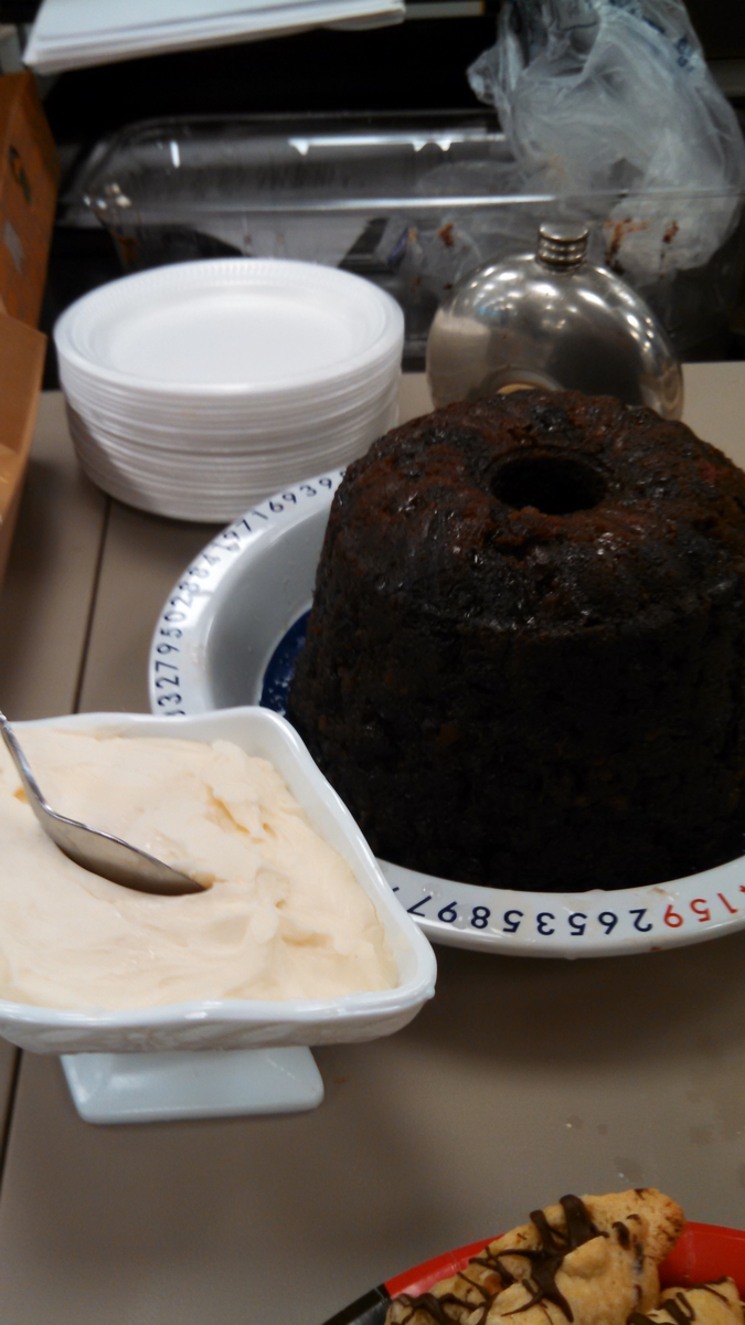 Christmas Pudding with Hard Sauce (foreground)